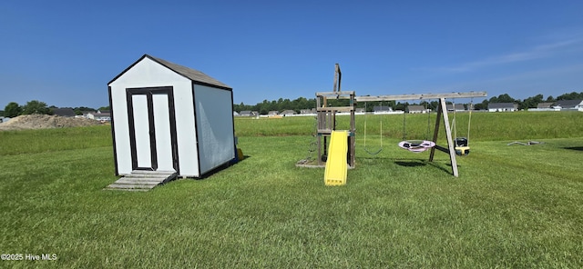 196 Asheberne Dr, Washington, NC 27889 - surrounding community with a playground, a lawn, and a shed