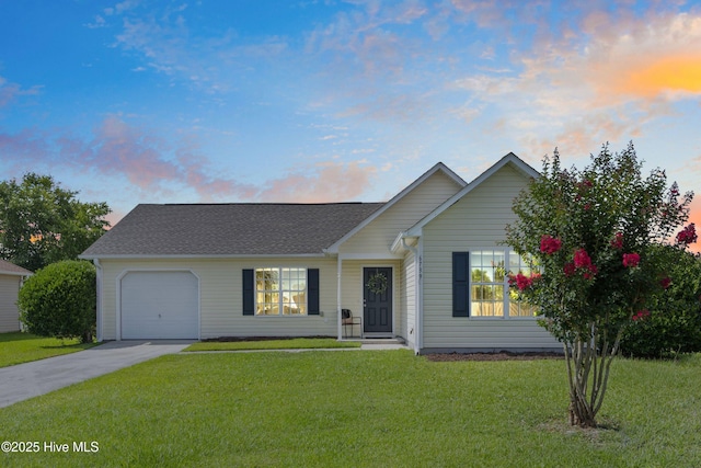 6739 Newbury Way, Wilmington, NC 28411 - view of front of property with concrete driveway, an attached garage, and a yard