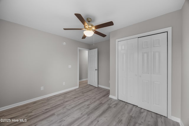 6739 Newbury Way, Wilmington, NC 28411 - unfurnished bedroom featuring wood finished floors, a closet, and a ceiling fan