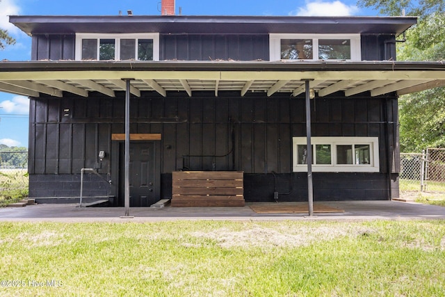 1955 Banks School Rd, Kinston, NC 28504 - view of front of property with board and batten siding and a chimney