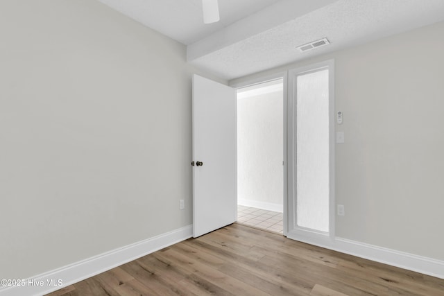 222 Carolina Beach Ave N Unit 230, Carolina Beach, NC 28428 - unfurnished room featuring wood finished floors and ceiling fan