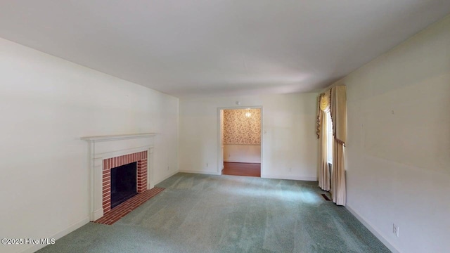 707 S Claiborne St, Goldsboro, NC 27530 - unfurnished living room featuring carpet and a fireplace