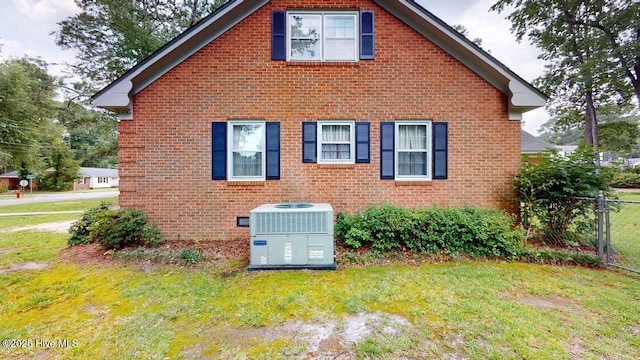 707 S Claiborne St, Goldsboro, NC 27530 - view of home's exterior featuring a central air condition unit and brick siding