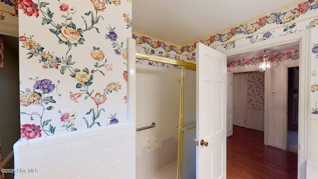 707 S Claiborne St, Goldsboro, NC 27530 - full bathroom with a stall shower, wood finished floors, and wallpapered walls