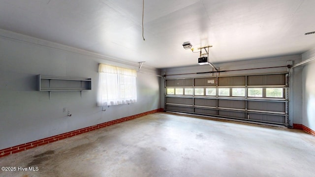 707 S Claiborne St, Goldsboro, NC 27530 - garage featuring baseboards and a garage door opener