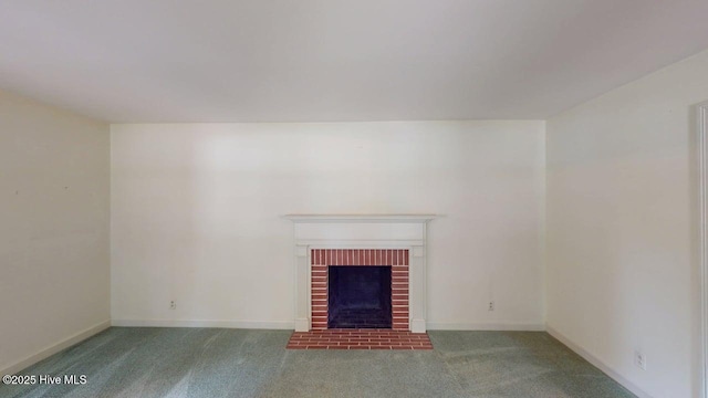 707 S Claiborne St, Goldsboro, NC 27530 - unfurnished living room featuring carpet and a fireplace
