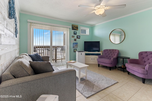 2224 New River Inlet Rd Unit 233, North Topsail Beach, NC 28460 - living room with crown molding, light tile patterned floors, and a ceiling fan