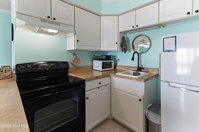 2224 New River Inlet Rd Unit 233, North Topsail Beach, NC 28460 - kitchen with white appliances, under cabinet range hood, and white cabinets