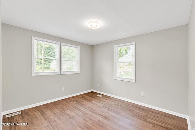 721 New River Dr, Jacksonville, NC 28540 - empty room featuring wood finished floors and baseboards