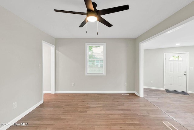 721 New River Dr, Jacksonville, NC 28540 - spare room featuring a ceiling fan and light wood finished floors