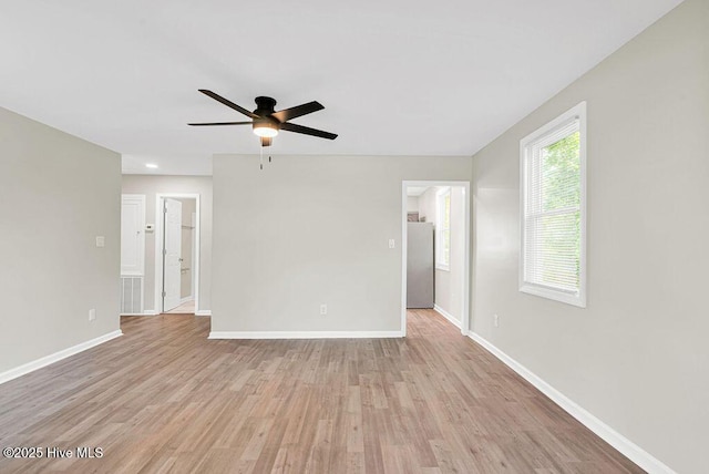 721 New River Dr, Jacksonville, NC 28540 - empty room with a ceiling fan and light wood finished floors