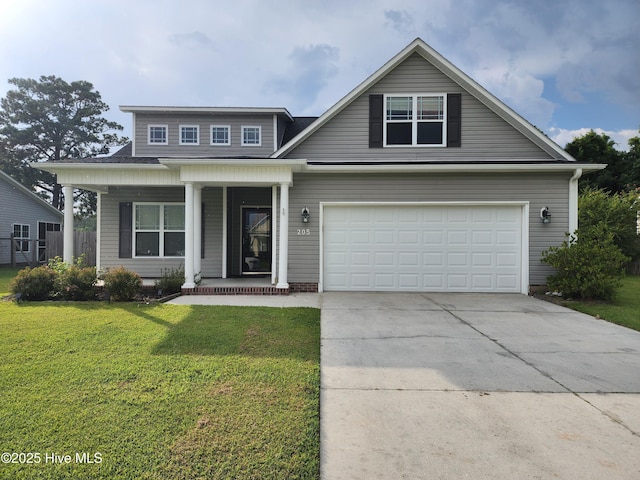 205 Channel Marker Loop, Swansboro, NC 28584 - view of front facade with a porch, concrete driveway, and a front lawn