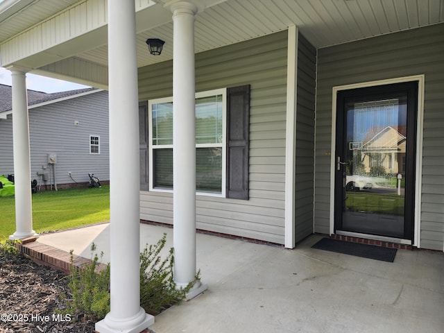 205 Channel Marker Loop, Swansboro, NC 28584 - doorway to property with covered porch and a lawn