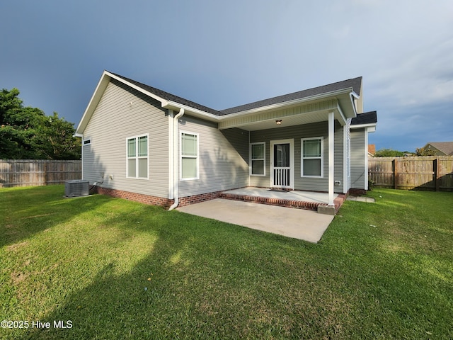 205 Channel Marker Loop, Swansboro, NC 28584 - back of house featuring a fenced backyard, a patio, and a shingled roof