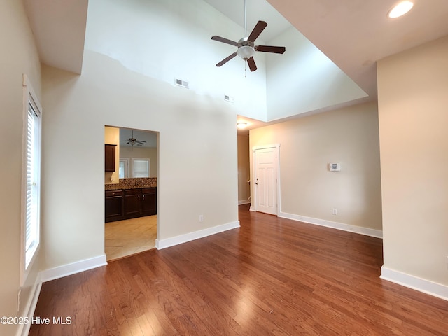 205 Channel Marker Loop, Swansboro, NC 28584 - unfurnished living room with a ceiling fan, wood finished floors, and high vaulted ceiling