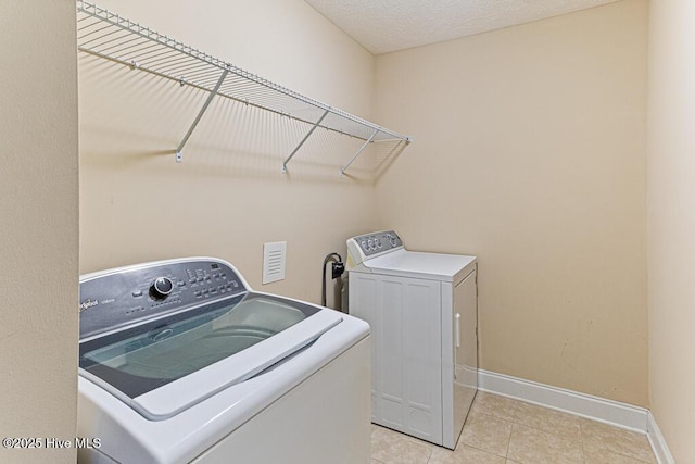 3 S Ct, Pinehurst, NC 28374 - laundry area with washing machine and clothes dryer and light tile patterned floors