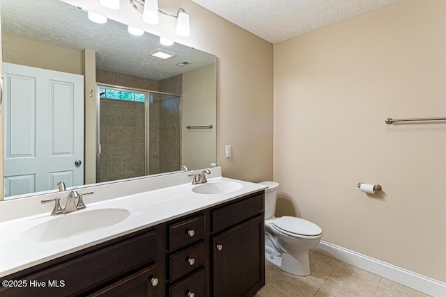 3 S Ct, Pinehurst, NC 28374 - full bath with a textured ceiling, double vanity, a tile shower, and tile patterned floors
