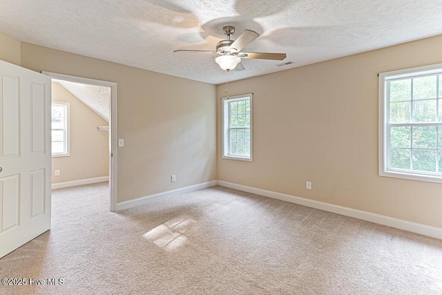 3 S Ct, Pinehurst, NC 28374 - spare room featuring a textured ceiling, ceiling fan, and light colored carpet