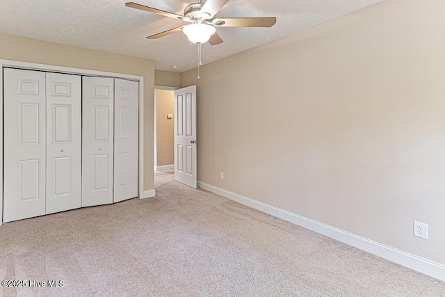 3 S Ct, Pinehurst, NC 28374 - unfurnished bedroom with carpet floors, a closet, a ceiling fan, and a textured ceiling