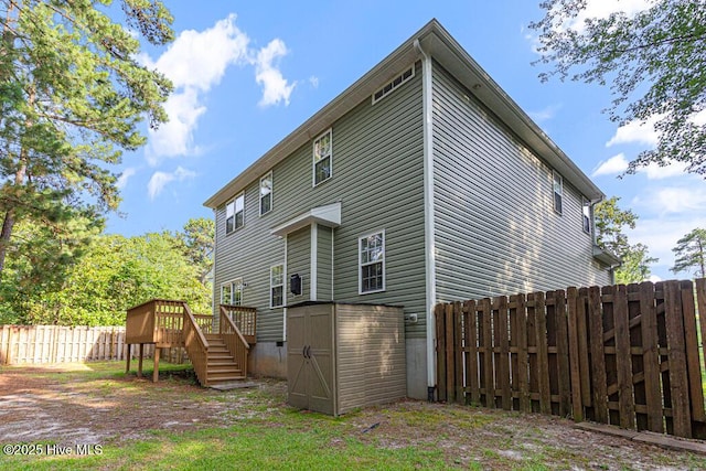 3 S Ct, Pinehurst, NC 28374 - rear view of house featuring a wooden deck, a fenced backyard, a shed, and stairway