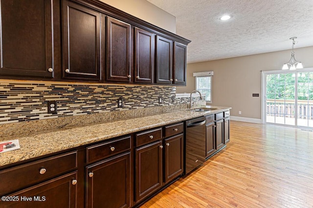 3 S Ct, Pinehurst, NC 28374 - kitchen with dishwasher, a textured ceiling, backsplash, light wood finished floors, and dark brown cabinets