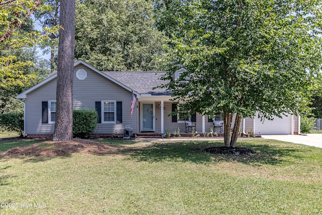 306 Goldleaf Dr, Goldsboro, NC 27534 - view of front of home with concrete driveway, a shingled roof, a front lawn, and a porch