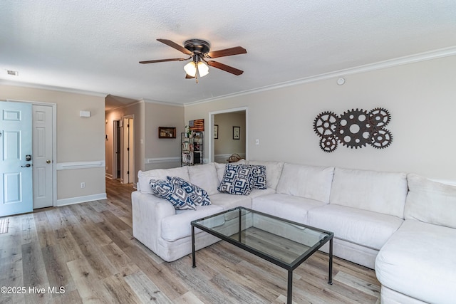 306 Goldleaf Dr, Goldsboro, NC 27534 - living room with ceiling fan, ornamental molding, a textured ceiling, and wood finished floors