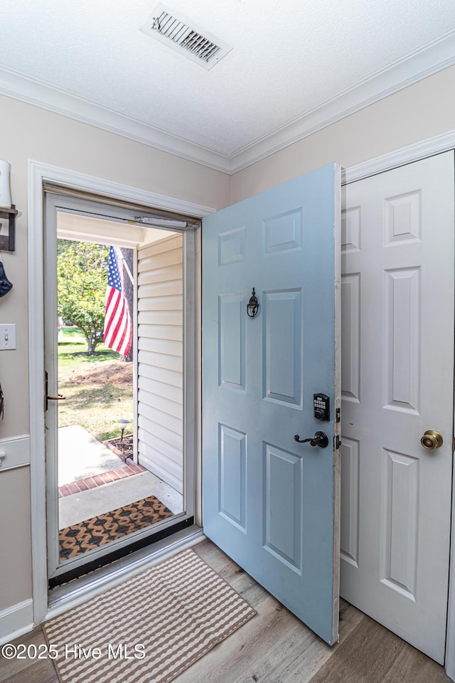 306 Goldleaf Dr, Goldsboro, NC 27534 - entrance foyer featuring crown molding and light wood-type flooring