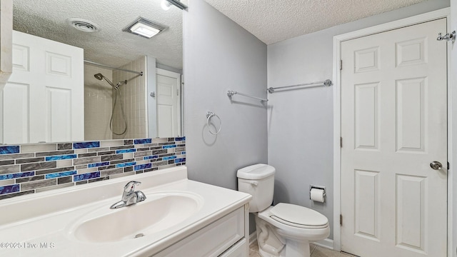 800 Saint Andrews Dr # 156, Pinehurst, NC 28374 - bathroom featuring a textured ceiling, vanity, decorative backsplash, and a shower