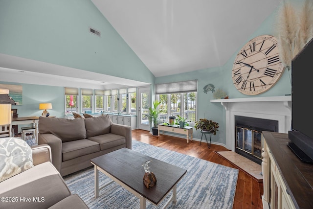 117 Forecastle Ct, Washington, NC 27889 - living room with high vaulted ceiling, a fireplace with flush hearth, and wood finished floors