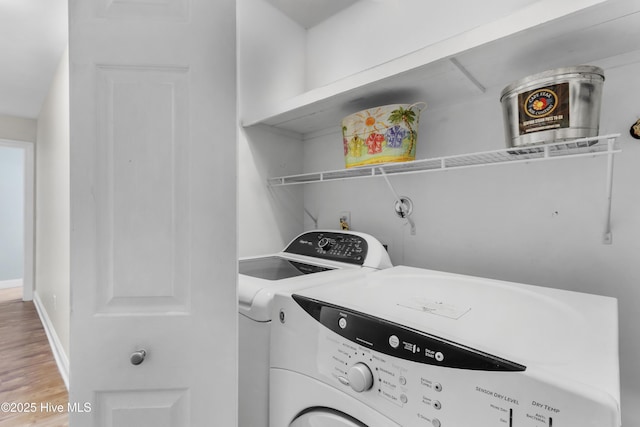1711 Carolina Beach Ave N Unit B, Carolina Beach, NC 28428 - washroom featuring washer and dryer and light wood-style flooring