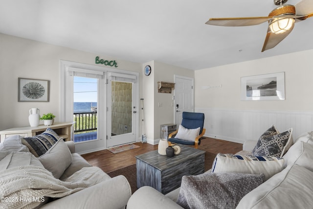 1711 Carolina Beach Ave N Unit B, Carolina Beach, NC 28428 - living room with wood finished floors, ceiling fan, a wainscoted wall, and a water view