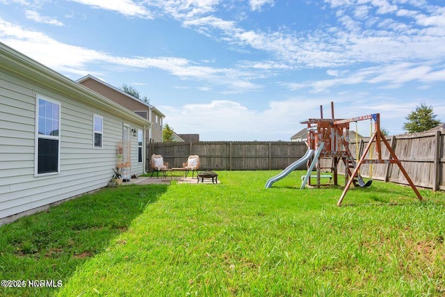 939 Dynamo Ln, Jacksonville, NC 28546 - fenced backyard with a playground and a patio
