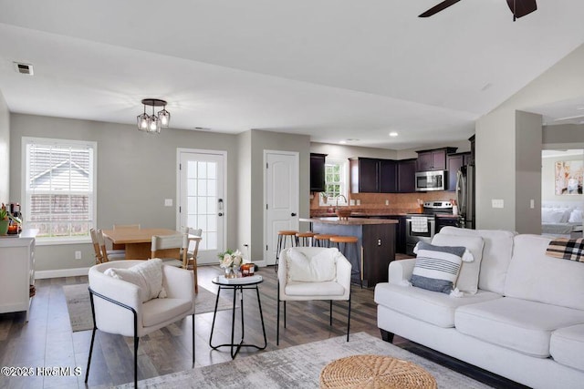 939 Dynamo Ln, Jacksonville, NC 28546 - living room featuring wood finished floors, ceiling fan, and recessed lighting
