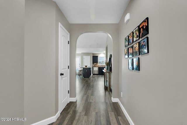 939 Dynamo Ln, Jacksonville, NC 28546 - corridor with arched walkways and dark wood-style flooring