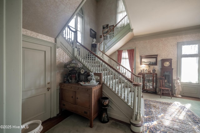 900 Nash St N, Wilson, NC 27893 - staircase featuring wallpapered walls and ornamental molding