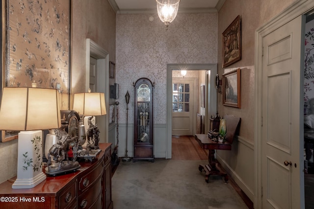 900 Nash St N, Wilson, NC 27893 - entryway featuring crown molding, wallpapered walls, and light carpet