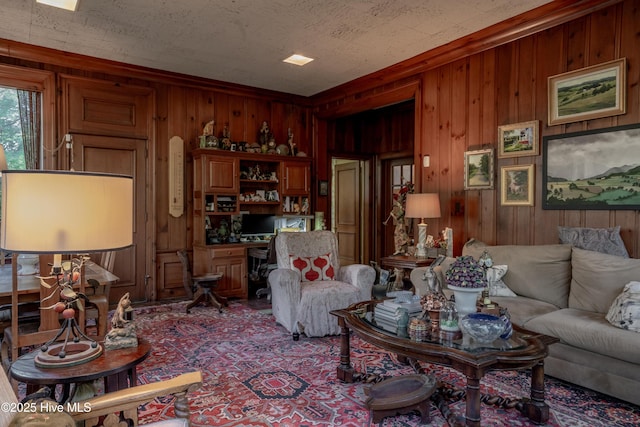 900 Nash St N, Wilson, NC 27893 - living room with wooden walls and carpet floors