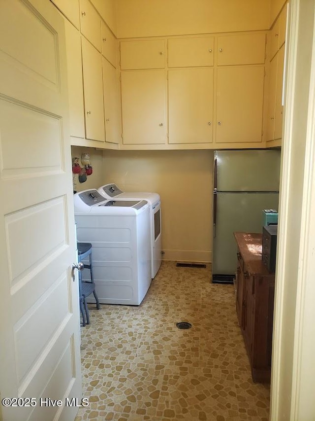 900 Nash St N, Wilson, NC 27893 - washroom with cabinet space and washer and dryer