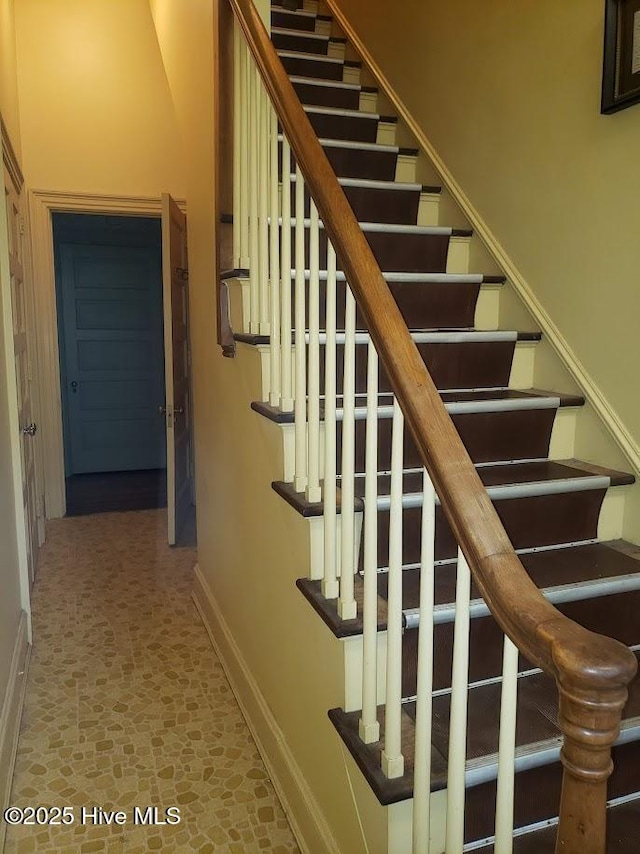 900 Nash St N, Wilson, NC 27893 - stairway with baseboards and stone finish flooring