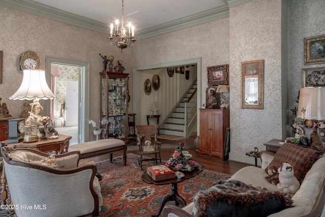 900 Nash St N, Wilson, NC 27893 - living area with wood finished floors, wallpapered walls, a chandelier, stairway, and ornamental molding