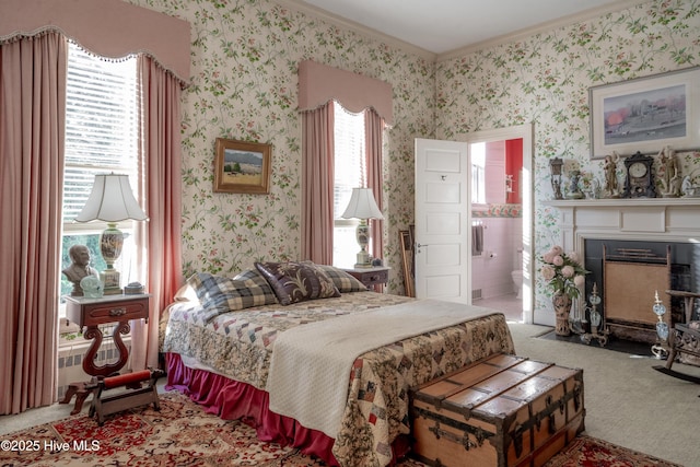 900 Nash St N, Wilson, NC 27893 - bedroom featuring wallpapered walls, crown molding, carpet, a fireplace with flush hearth, and connected bathroom
