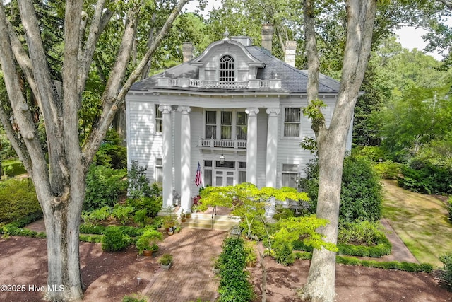 900 Nash St N, Wilson, NC 27893 - greek revival inspired property with a chimney and view of scattered trees