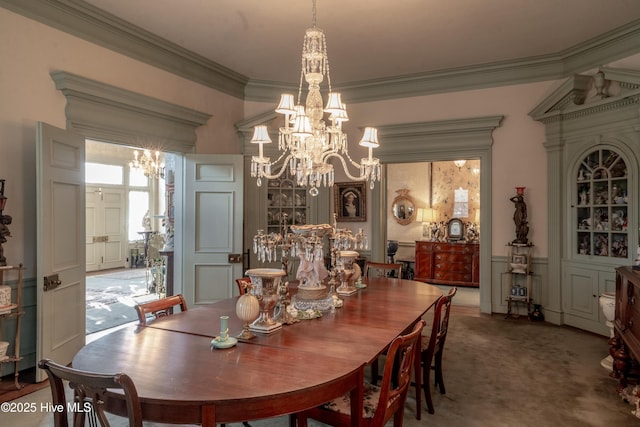 900 Nash St N, Wilson, NC 27893 - dining area featuring a chandelier, ornamental molding, carpet floors, and wainscoting