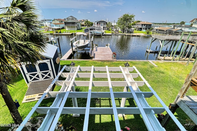 4061 4th St, Surf City, NC 28445 - dock with boat lift, a water view, and a residential view