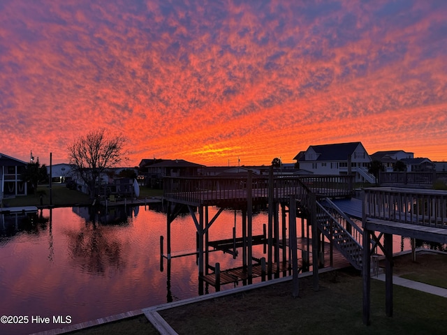 4061 4th St, Surf City, NC 28445 - dock featuring a residential view and a deck with water view
