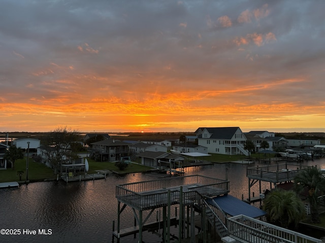 4061 4th St, Surf City, NC 28445 - water view with nearby suburban area and a boat dock