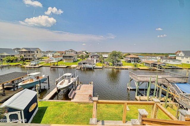 4061 4th St, Surf City, NC 28445 - dock featuring boat lift, a water view, and a residential view