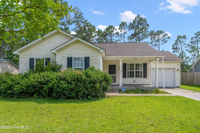 32 S Shelby Rd, Southport, NC 28461 - ranch-style house with a garage, driveway, a porch, and a shingled roof