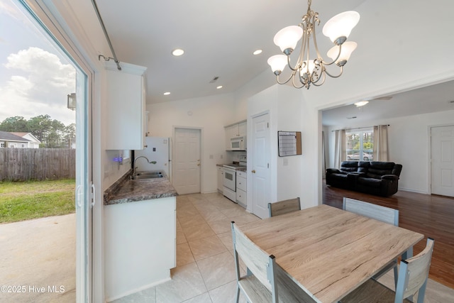 32 S Shelby Rd, Southport, NC 28461 - dining space with a chandelier and recessed lighting